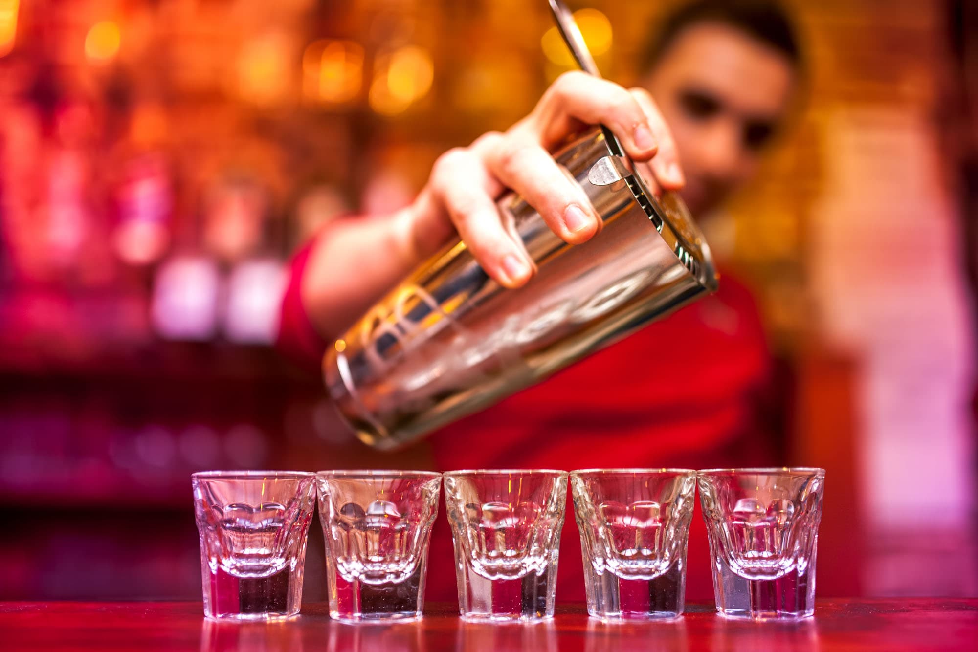 Bartender shaking a craft cocktail for a wedding bar service